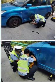 金寨：轎車爆胎停滯路邊，暖心交警幫忙解困