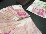合肥市民將2萬多元現金遺落出租車 的姐物歸原主