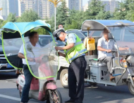 網(wǎng)友建議合肥市區(qū)禁止摩托車、電動車安裝遮陽傘 官方回復