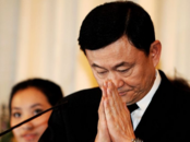 他信被指控犯有冒犯君主罪